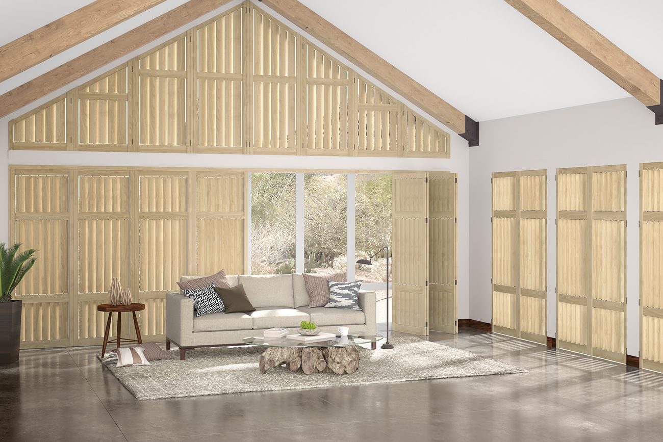 Custom wood shutters installed in a vaulted living room