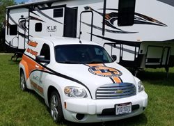 Columbus Blind Company van in front of an RV